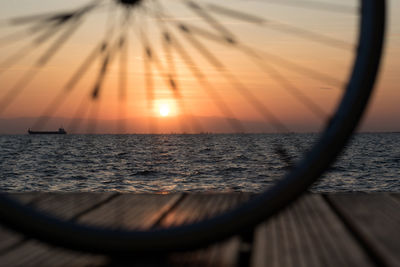 Close-up of sea against sky during sunset