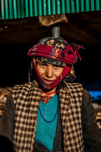 Portrait of an old woman wearing winter clothes