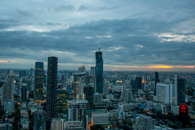 Aerial view of modern buildings in city against sky