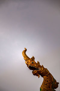 Low angle view of a statue against clear sky