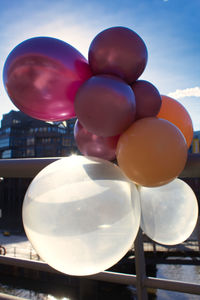Low angle view of balloons against sky