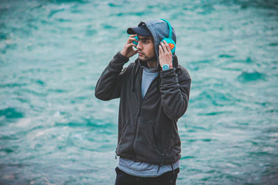 Young man looking at sea