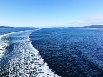 Scenic view of sea against clear blue sky