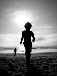 Boy running on beach