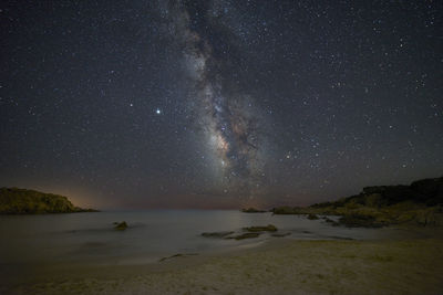 Scenic view of sea against sky at night