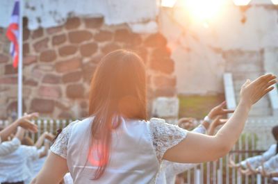 Close-up of woman using mobile phone outdoors