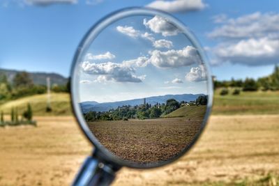 Reflection of sky on side-view mirror