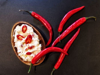 High angle view of red chili peppers on table