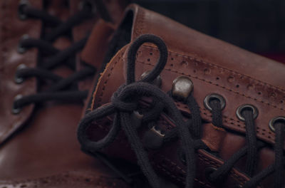 High angle view of rusty chain tied up on metal