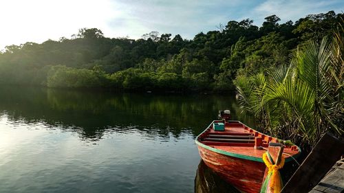 Boat in lake against sky