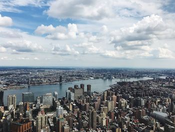 High angle view of cityscape against cloudy sky