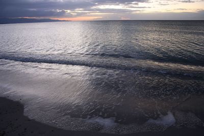 Scenic view of sea against sky at sunset