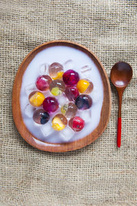 Directly above shot of fruit jelly dessert served in plate on table