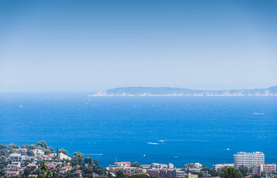 Scenic view of sea against clear blue sky