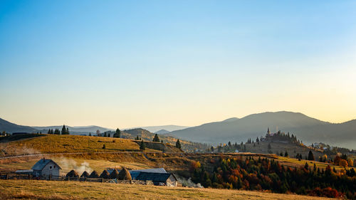 Landscape with buildings in background