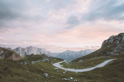 Scenic view of mountains against cloudy sky