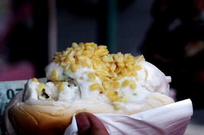 Close-up of hand holding ice cream