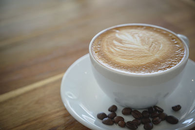 Close-up of cappuccino on table