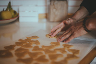 Midsection of man preparing food at home