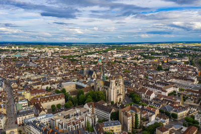 High angle view of townscape against cloudy sky