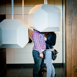 Low section of woman standing on floor at home