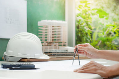 Midsection of woman working on table