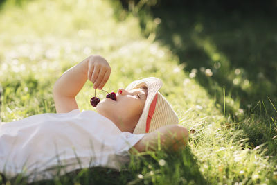 Woman lying on grass