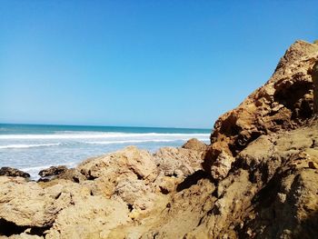 Scenic view of sea against clear sky