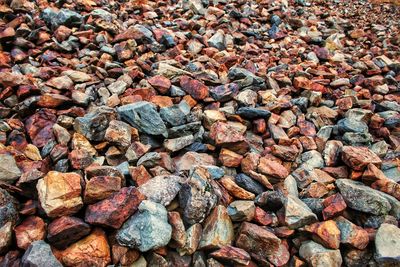 High angle view of pebbles on rocks