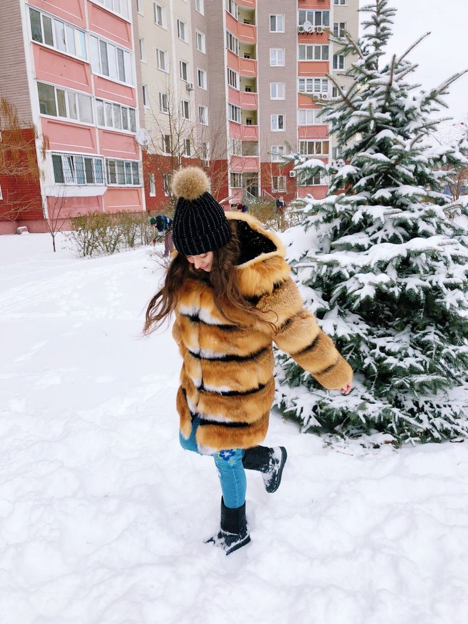 winter, snow, cold temperature, warm clothing, full length, clothing, building exterior, one person, real people, built structure, lifestyles, architecture, nature, leisure activity, day, women, childhood, child, snowing, extreme weather