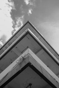 Low angle view of building against cloudy sky