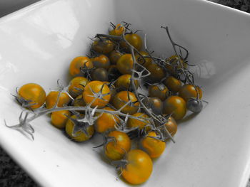 High angle view of fruits in basket on table