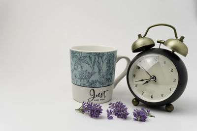 Close-up of clock against white background