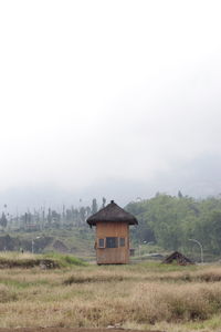 House on field against sky