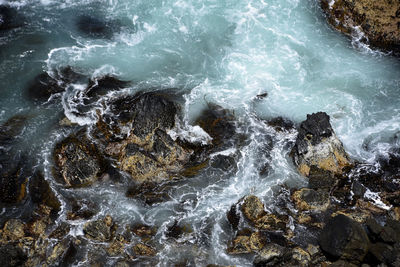 View of waves splashing on rocks