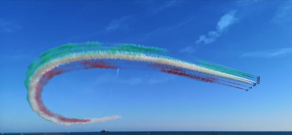 Aerial view of vapor trail against blue sky