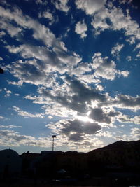 Silhouette of tree against cloudy sky