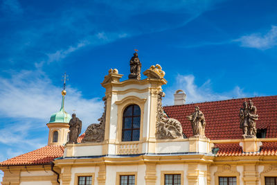 Low angle view of historic building against blue sky