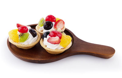 Close-up of dessert served on white background