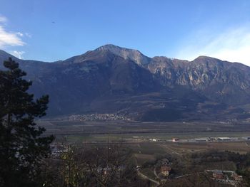 Scenic view of mountains against blue sky
