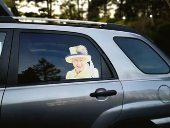 Reflection of car on side-view mirror