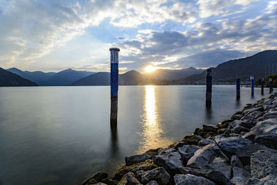 Scenic view of lake against sky during sunset