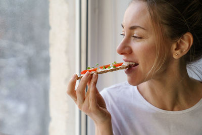 Portrait of woman eating food