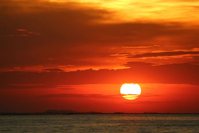 Scenic view of sea against romantic sky at sunset