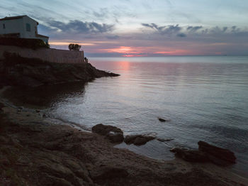 Scenic view of sea against sky during sunset