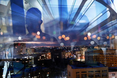 Illuminated buildings in city at night