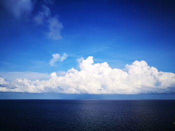 Scenic view of sea against blue sky