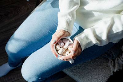 Midsection of man holding hands