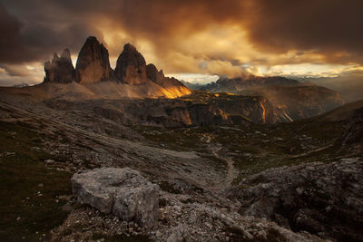 Scenic view of mountains against cloudy sky