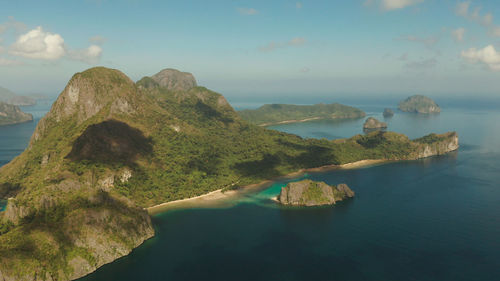 Panoramic view of sea and mountains against sky